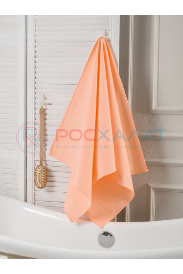 Однотонное вафельное полотенце нежно-персиковое  